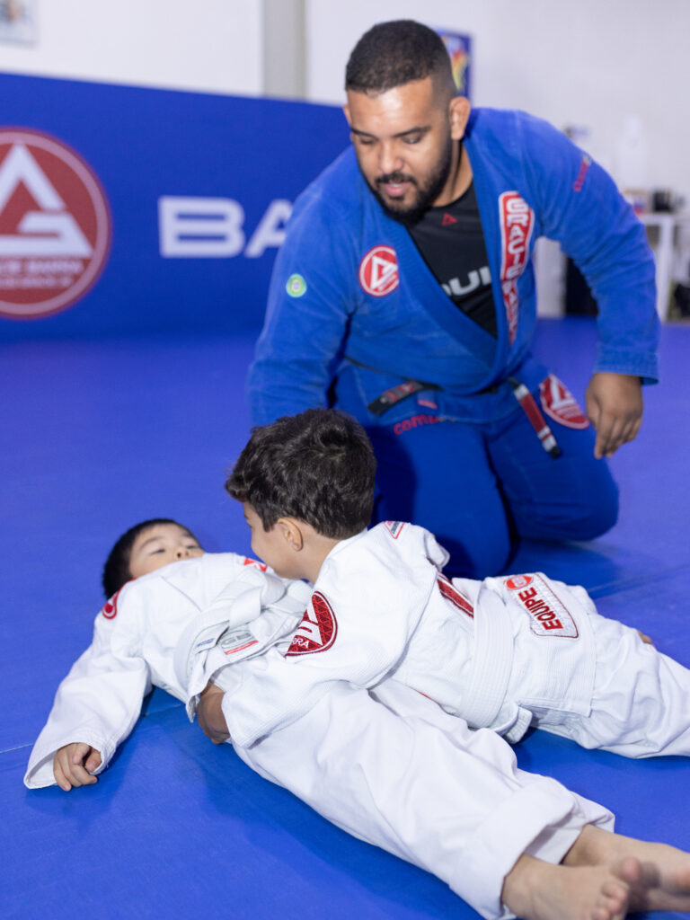 Kids training in bjj teacher self-defense
